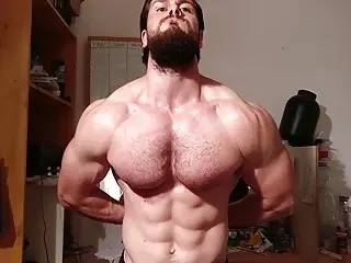 Bearded and muscled guy worships his pecks  