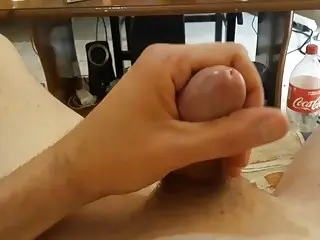 Jacking off a shaved cock until it spurts