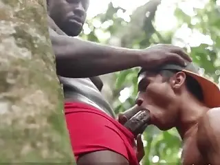 Three African guys smoke a joint and have a tribal fuck in the forest 